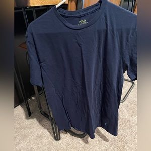 Polo t size medium. Navy blue with light blue polo sign